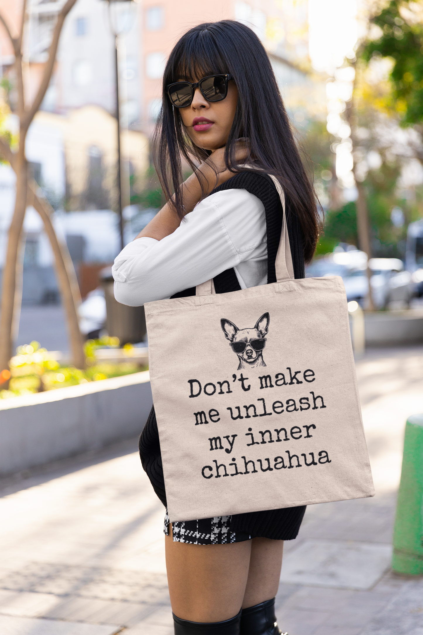 Woman holding psycho chihuahua bag