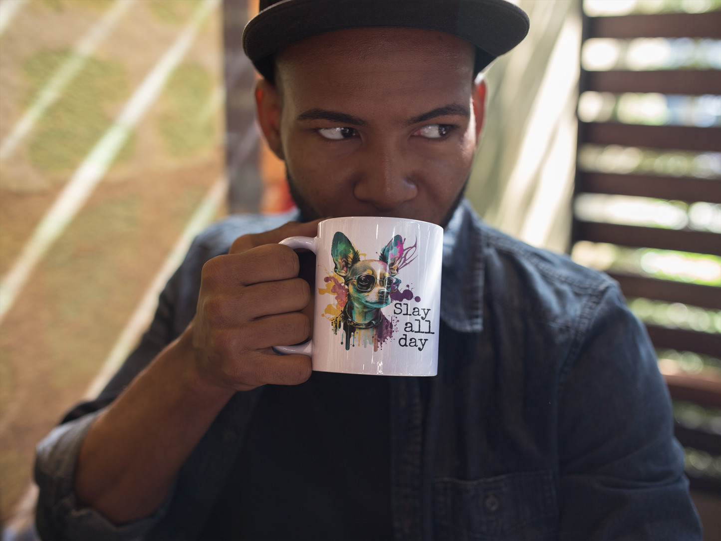 Man holding Slay inspirational coffee mug